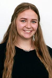 woman with light brown hair wearing a black shirt